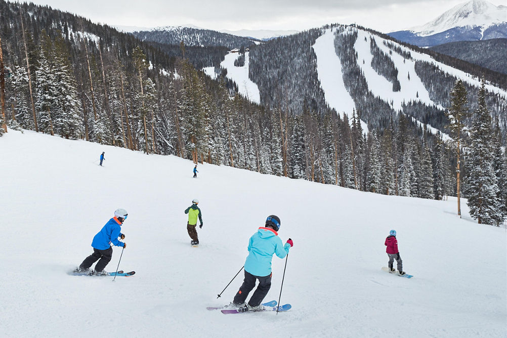 Friends skiing down Mozart at Keystone, CO