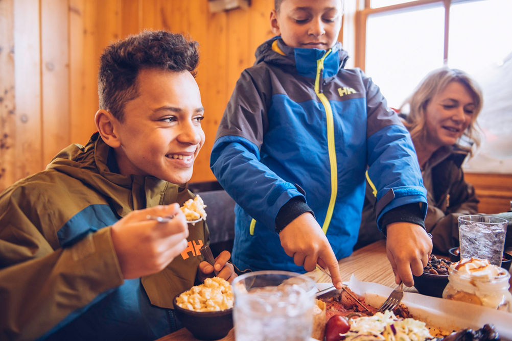 Family enjoying food and drinks at Summit Smokehouse in Northstar California