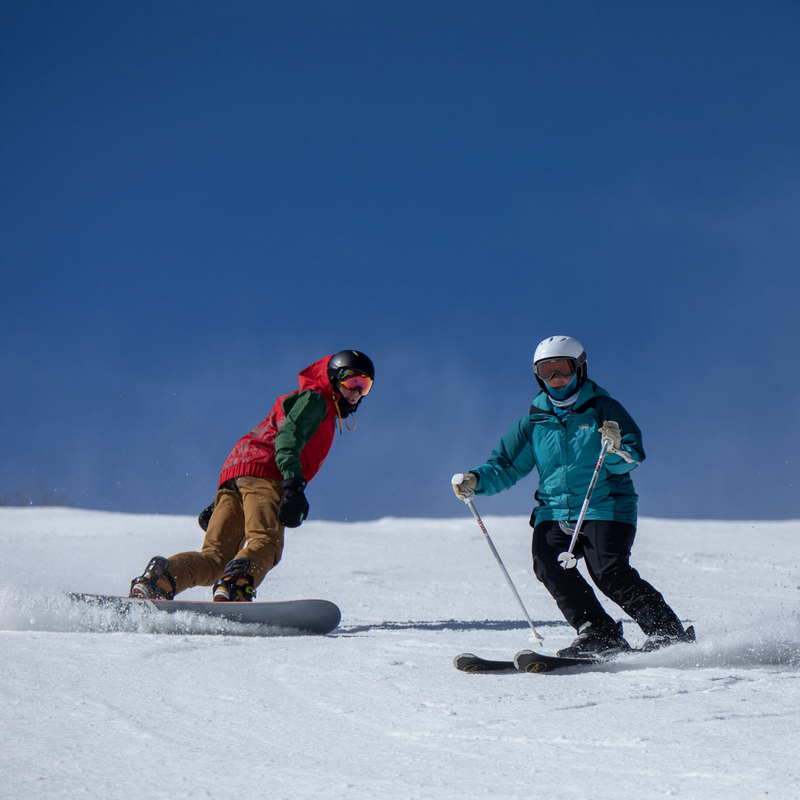 Skier and Rider Make Turns on Drop In at Whitetail