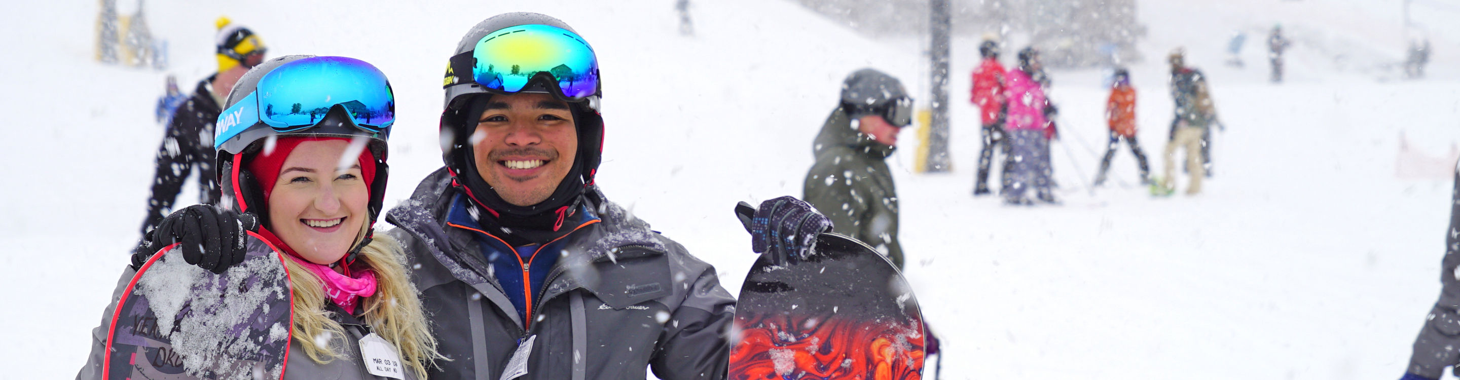 Two Snowboarders Pose on Ski Run at Mad River Mountain