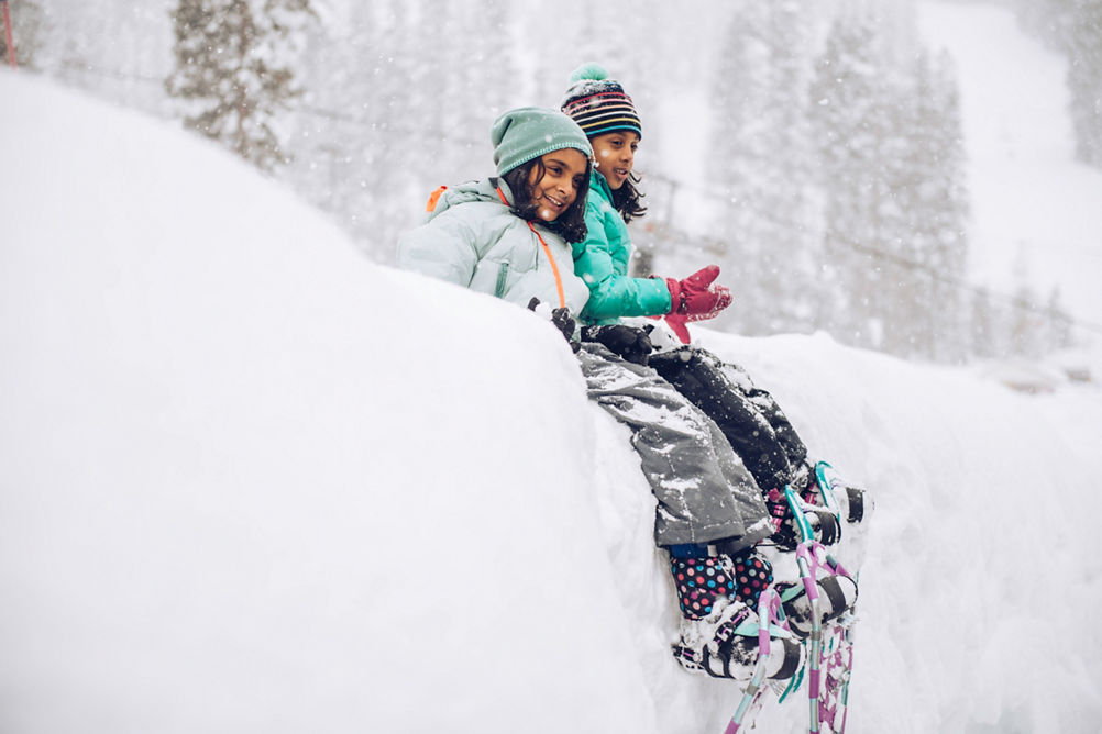 Family playing in the snow in Northstar, CA.