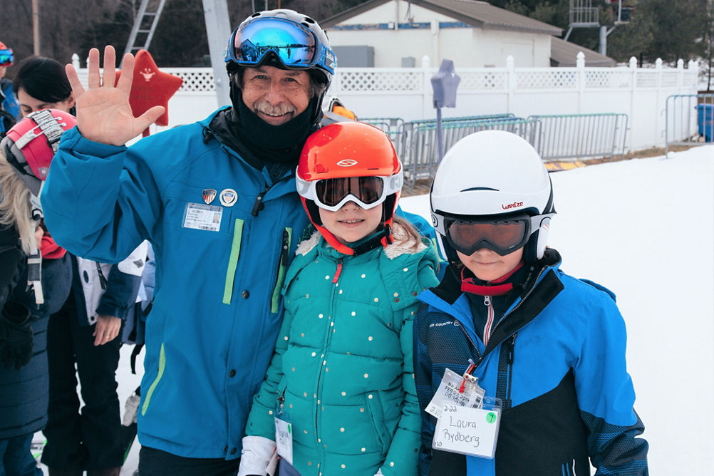 Two Kids Pose with Ski Instructor at Liberty Mountain
