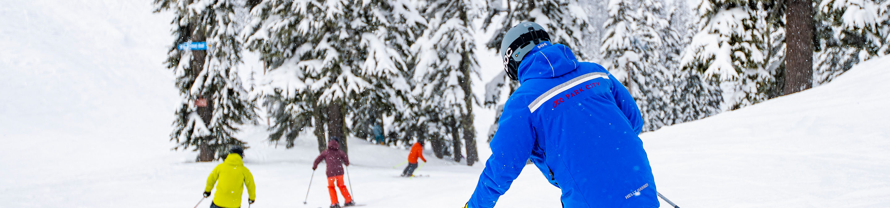 Downhill View of Group Ski and Ride School at Stevens Pass