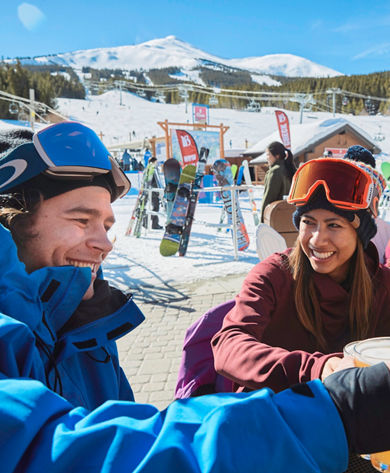 Friends enjoying food and drinks after skiing at Breckenridge, CO.