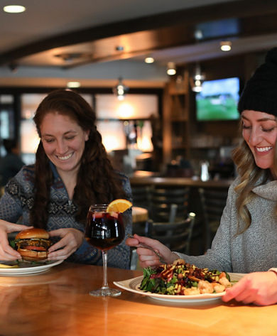 Two Women Enjoy Dinner and Drinks at Liberty Mountain