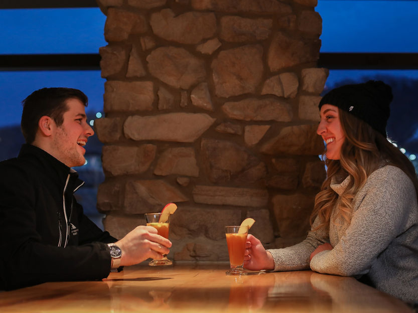 Couple Talk Over Cocktails at Liberty Mountain
