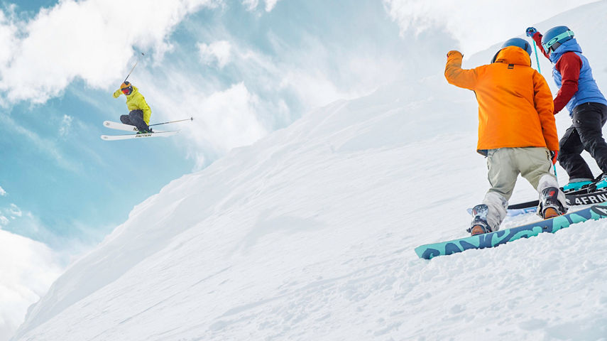Friends skiing and snowboarding at Breckenridge, CO.