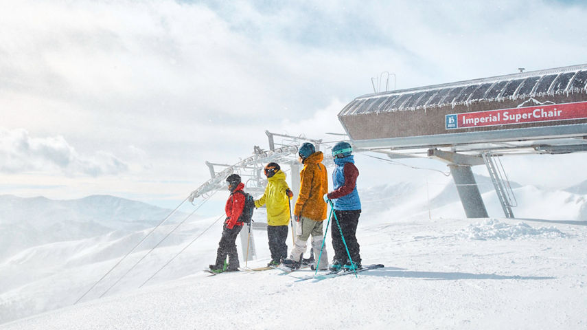 Friends skiing and snowboarding at Breckenridge, CO.