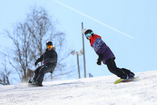 Two Snowboarders Make Turns on Liberty Mountain