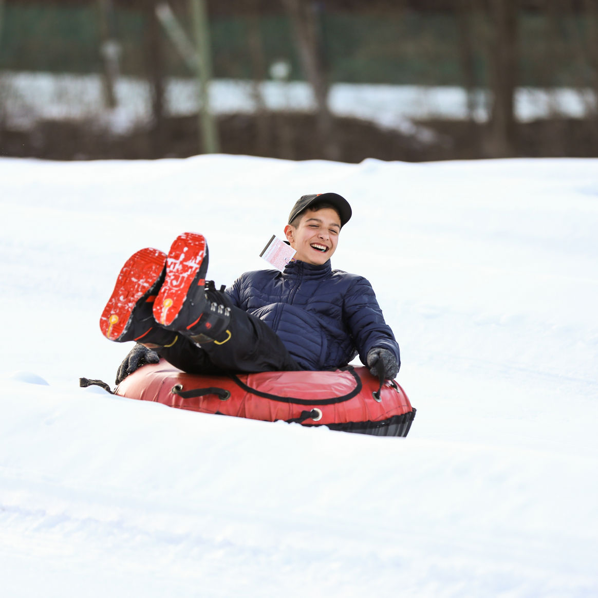 Little Boy Tubes Downhill at Liberty Mountain