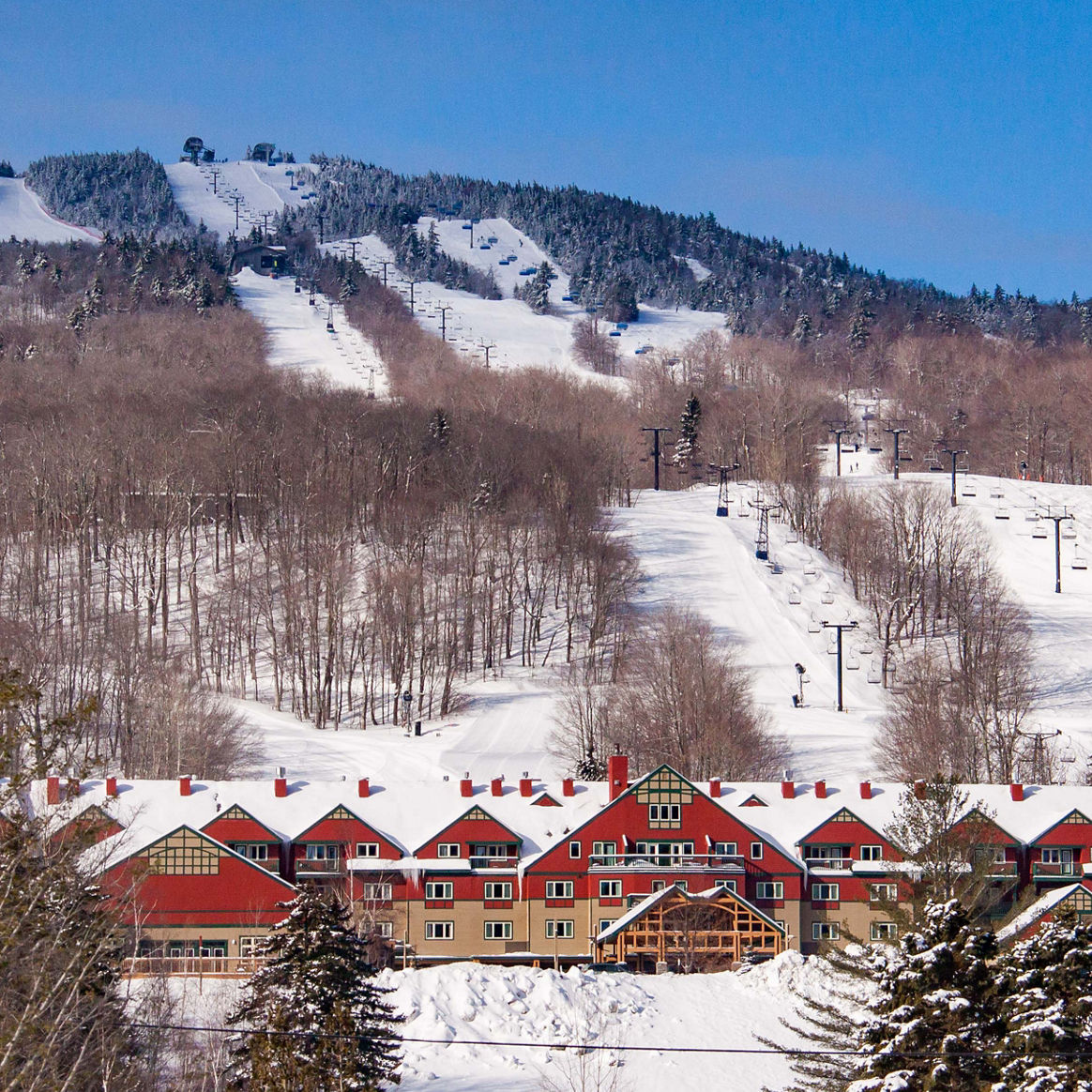Grand Summit Resort Hotel at Mount Snow with Snowy Mountain in Background