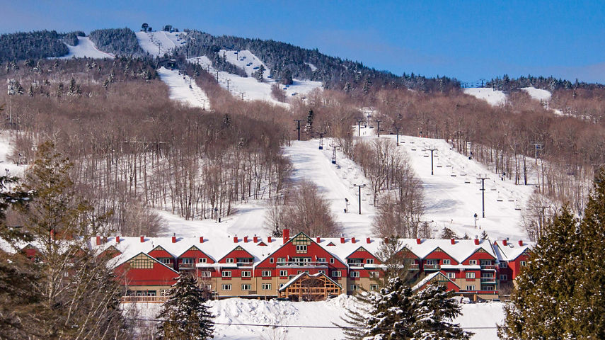 Grand Summit Resort Hotel at Mount Snow with Snowy Mountain in Background
