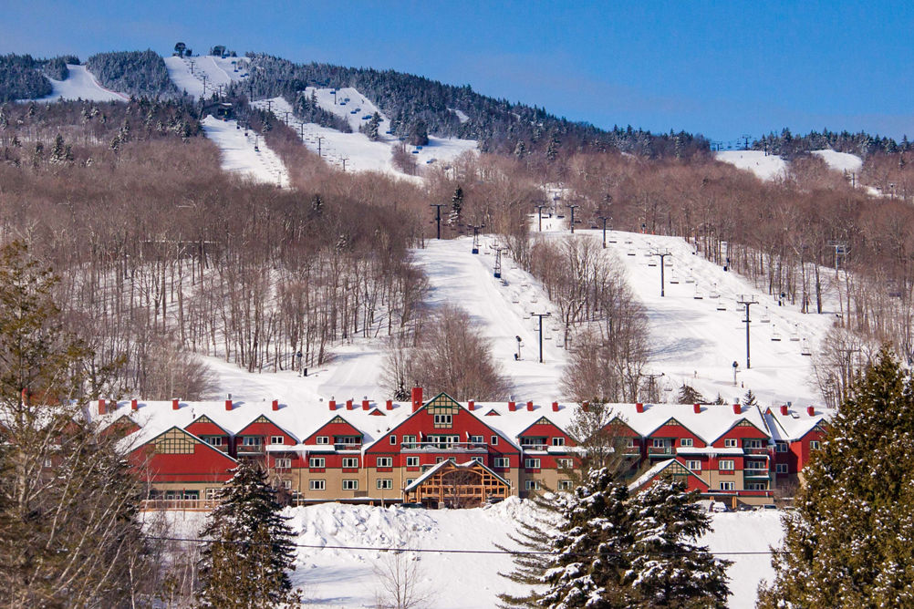 Grand Summit Resort Hotel at Mount Snow with Snowy Mountain in Background