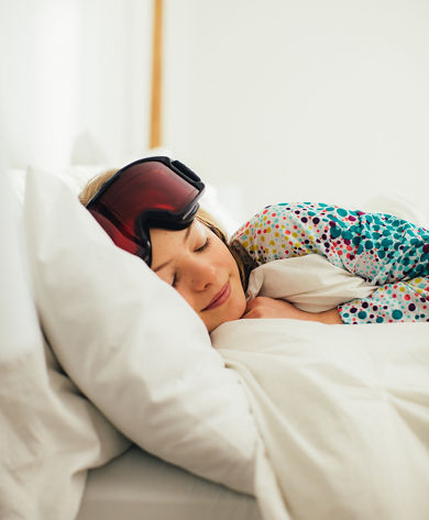 Daughter Snuggles in Bed with Goggles at Stowe
