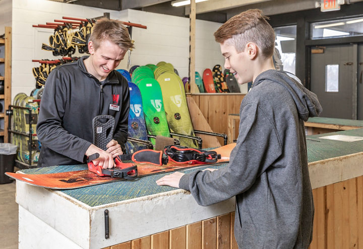 Staff Helping Family in Rentals at Wilmot Mountain