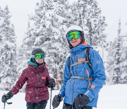 Friends enjoy a powder day on advanced terrain in Keystone, CO.