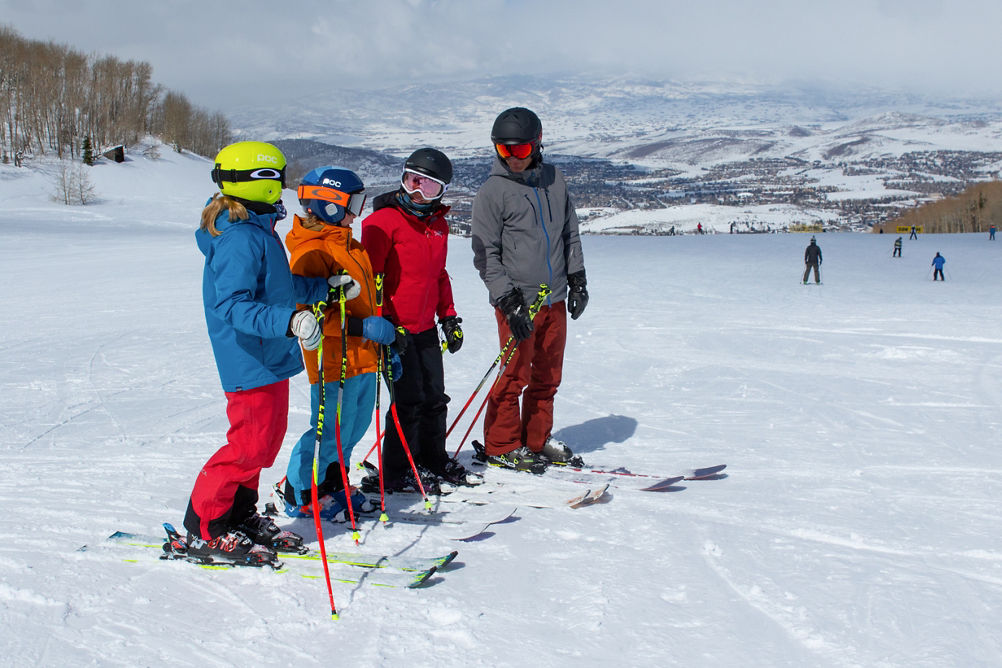 Family stopped on a ski run in Park City