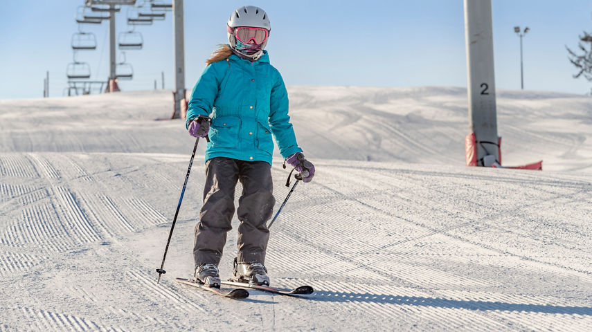 Teenage Girl Skis Downhill at Wilmot Mountain