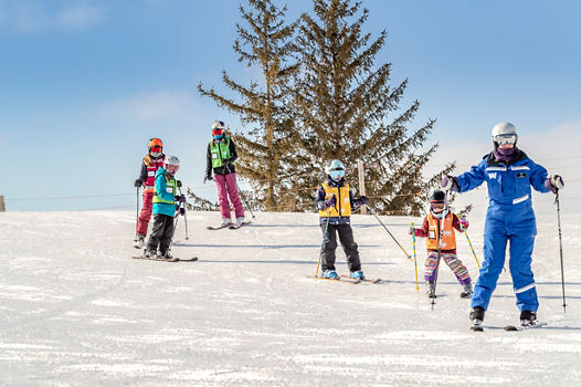 Friends and Family Taking Children's Ski Lessons at Wilmot Mountain