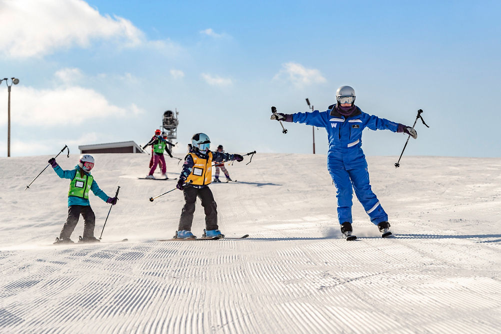 Friends and Family Taking Children's Ski Lessons at Wilmot Mountain
