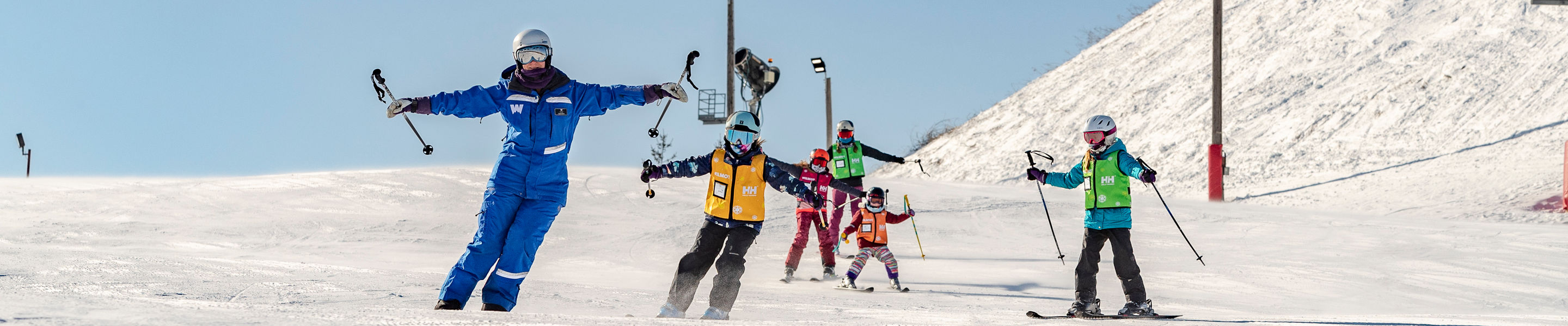 Friends and Family Taking Children's Ski Lessons at Wilmot Mountain