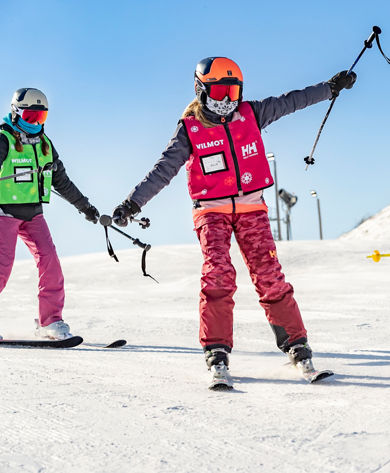 Friends and Family Taking Children's Ski Lessons at Wilmot Mountain