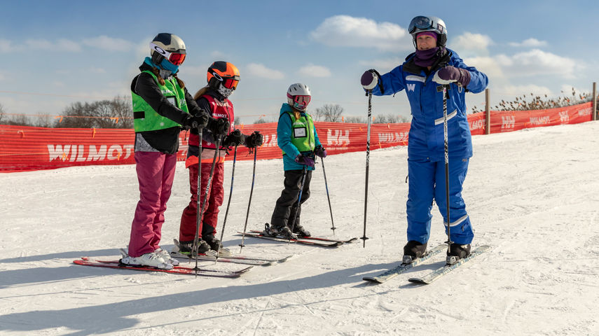 Friends and Family Taking Children's Ski Lessons at Wilmot Mountain