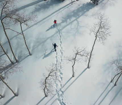 Couple snowshoeing in Beaver Creek, CO