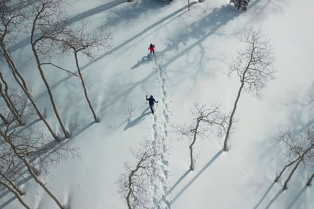 Couple snowshoeing in Beaver Creek, CO