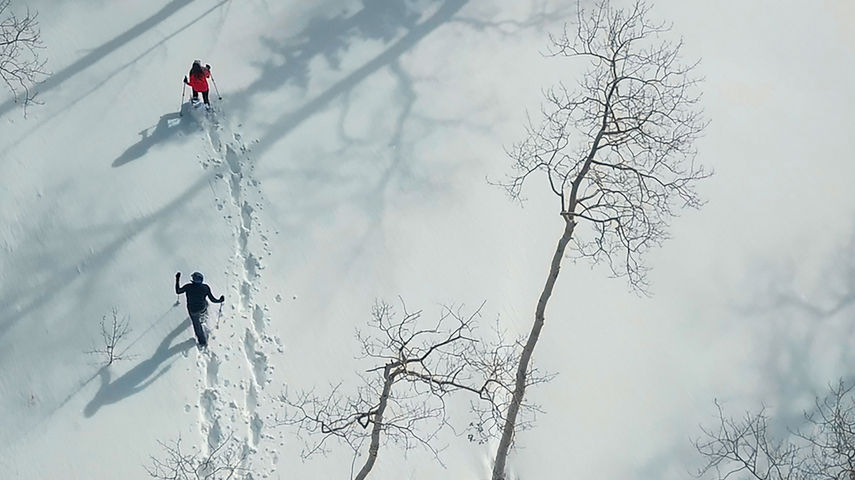 Couple snowshoeing in Beaver Creek, CO