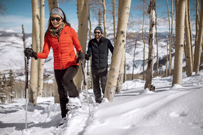 Couple snowshoeing in Beaver Creek, CO