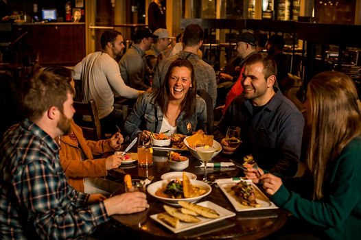 Friends enjoying dinner in Whistler Blackcomb.