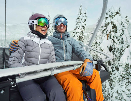 Couple in a chair lift in Vail, CO.