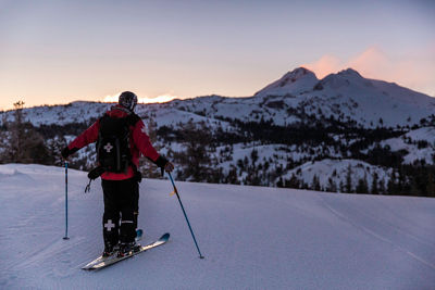Family skiing at twilight in Kirkwood, CA.