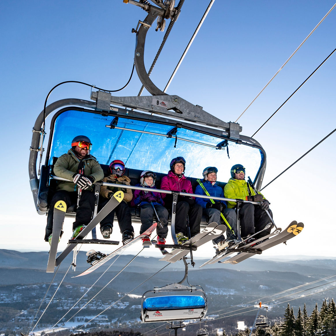 Family Rides the Bluebird Express Chairlift at Mount Snow