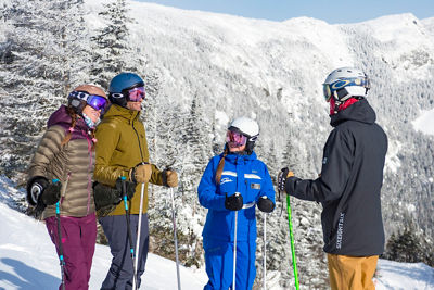 Group of friends in a ski school lesson at Stowe, VT.
