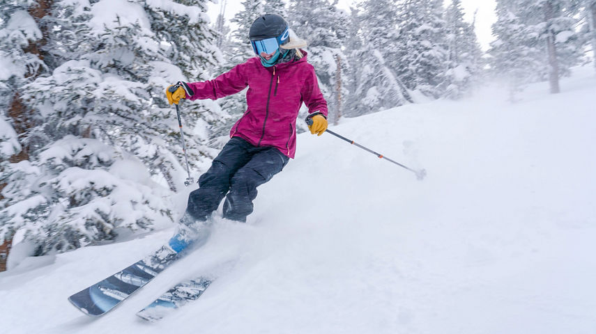 Friends ski the Outback and trees on a powder day at Keystone, CO.