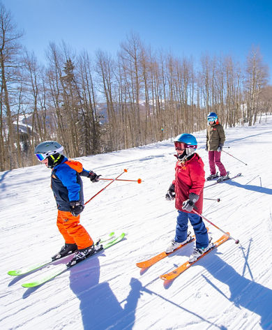 Family Having Fun Skiing at Beaver Creek, CO.