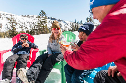 Family Enjoying Food and Drinks in the Sunshine in Kirkwood, CA.