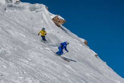 Woman skiing with Extreme Guides Ski and Ride School Instructor