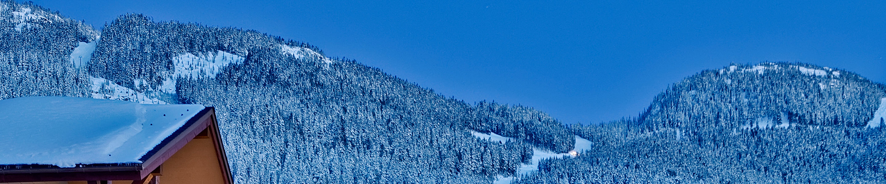 Exterior of a Snow Covered Evolution Condo Building at Whistler Blackcomb Mountain Resort