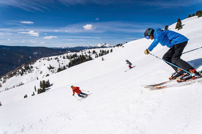 Friends skiing in the Back Bowls in Vail, CO.
