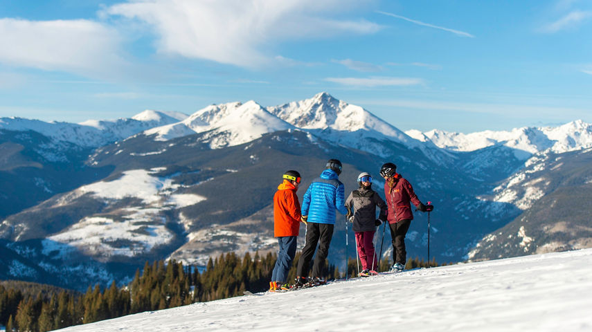 Friends skiing in the Back Bowls in Vail, CO.