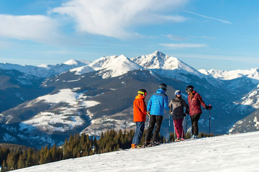 Friends skiing in the Back Bowls in Vail, CO.