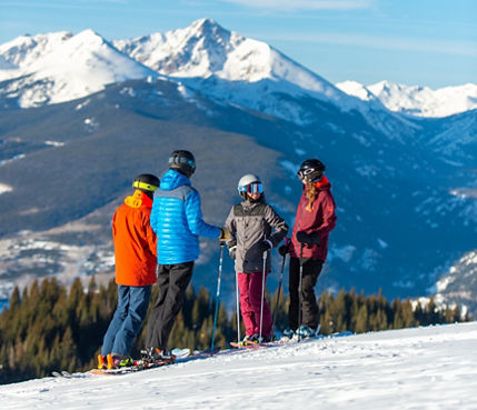 Friends skiing in the Back Bowls in Vail, CO.