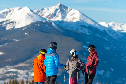 Friends skiing in the Back Bowls in Vail, CO.