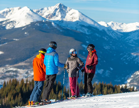 Friends skiing in the Back Bowls in Vail, CO.