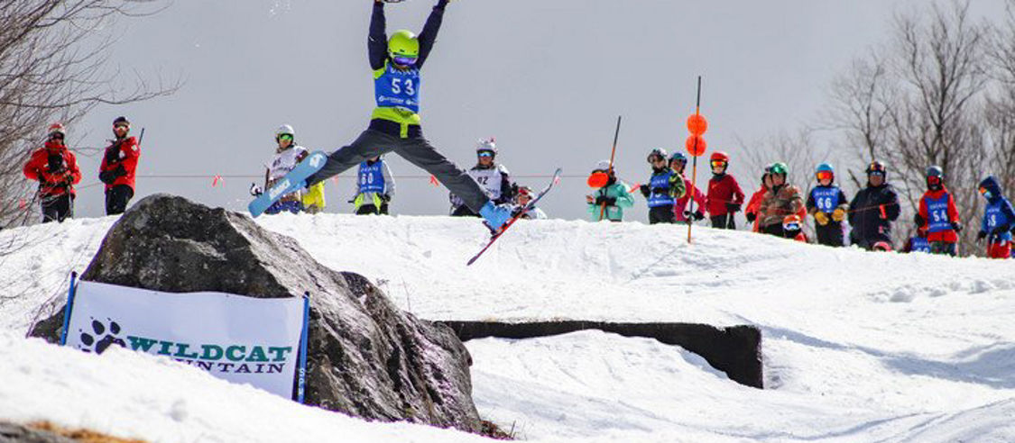 Skier Jumps Off Rock in Competition at Wildcat Mountain