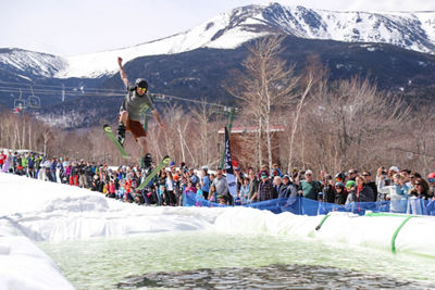 Skier in Costume Participates in Pond Skim at Wildcat Mountain