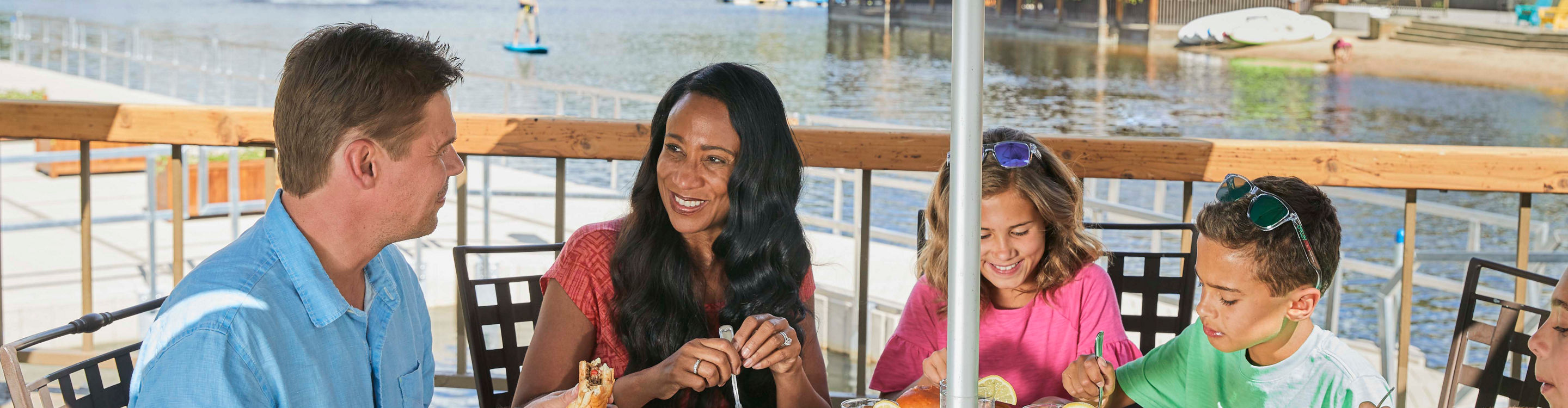 Family eats lunch at Edgewater Cafe in Lakeside Village at Keystone, CO.